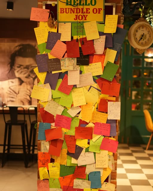 The Bundle of Joy wall covered in colourful guest notes